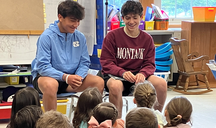 Older students speaking to younger students